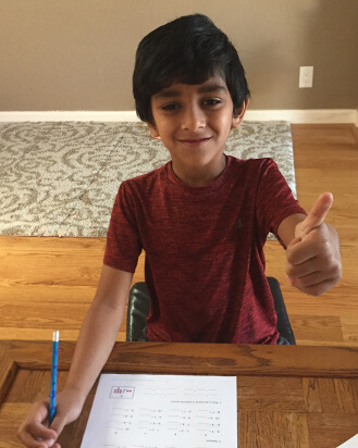 Boy doing a Math Mammoth placement test